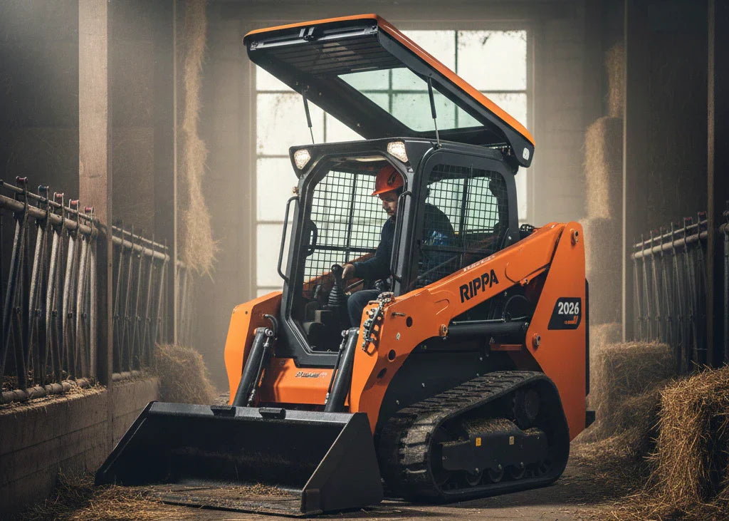 A modern skid steer with its roll-up door clearly visible in the "up" position, operating in a tight, indoor construction environment