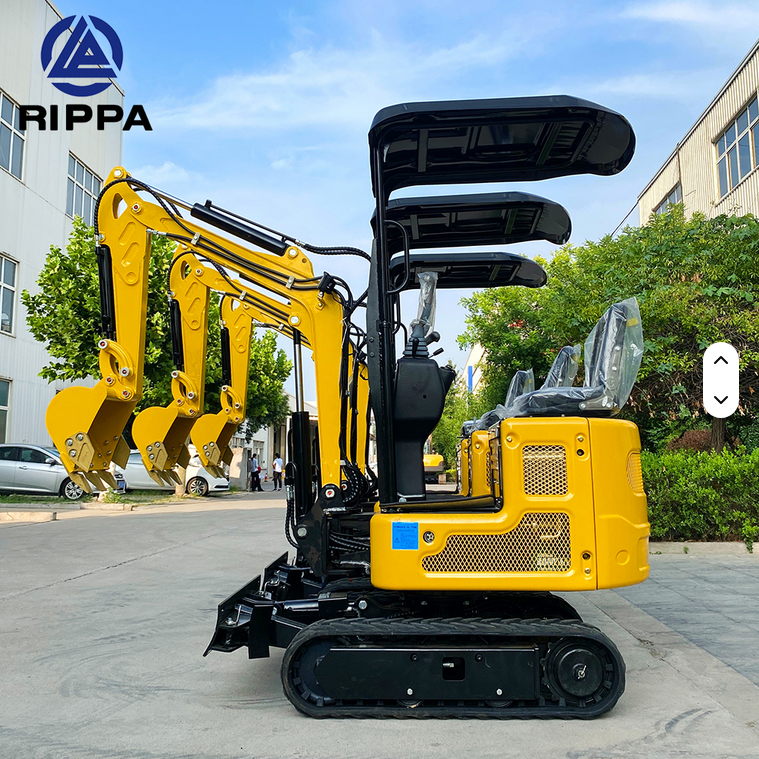 Yellow Rippa R319 mini excavator with swing boom, hydraulic thumb, and black rubber tracks outdoors.