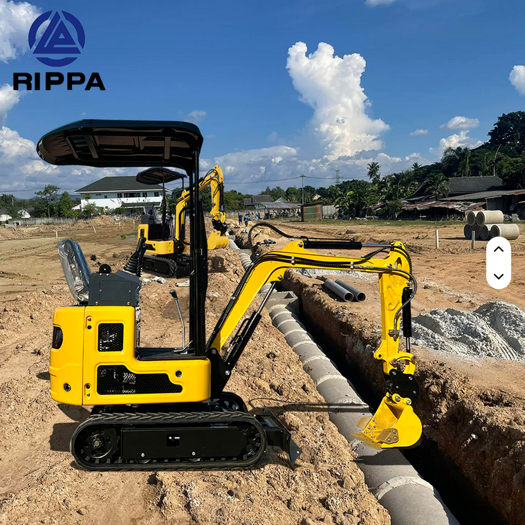 Yellow Rippa R319 mini excavator with swing boom and hydraulic thumb on black tracks at construction site.