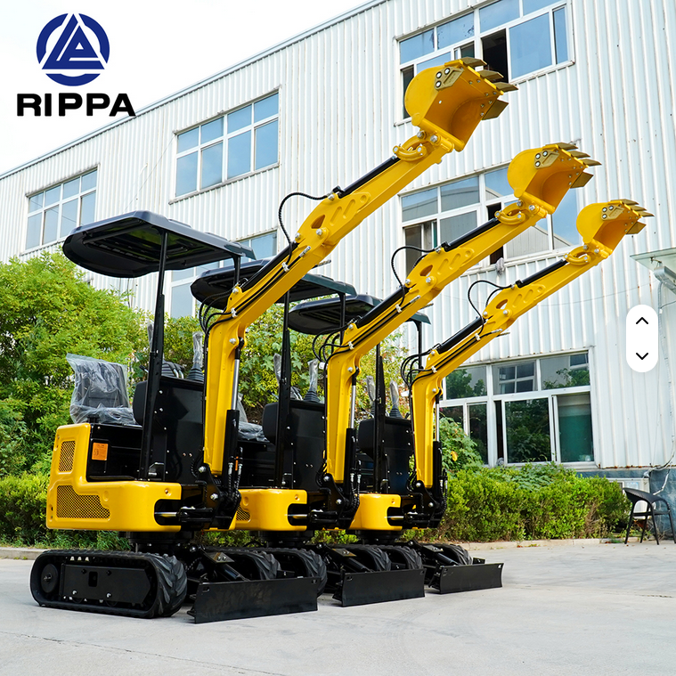 Three yellow Rippa R319 mini excavators with raised swing booms and hydraulic thumbs lined up outside a building.
