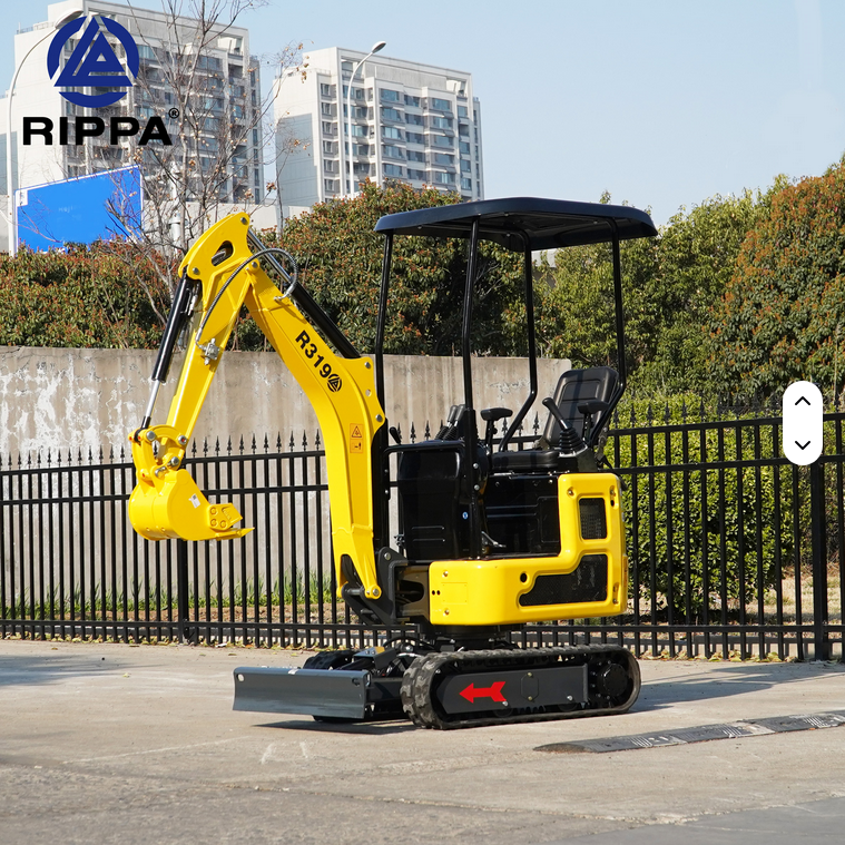 Yellow Rippa R319 mini excavator with open canopy, hydraulic arm, and rubber tracks on concrete surface.