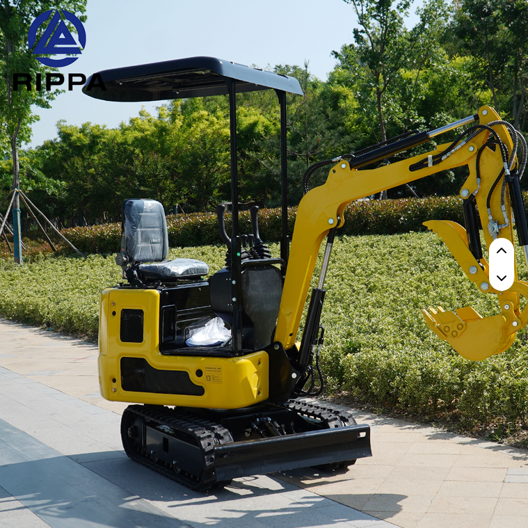 Yellow Rippa R319 1 Ton mini excavator with open cab, swing boom, and rubber tracks outdoors.