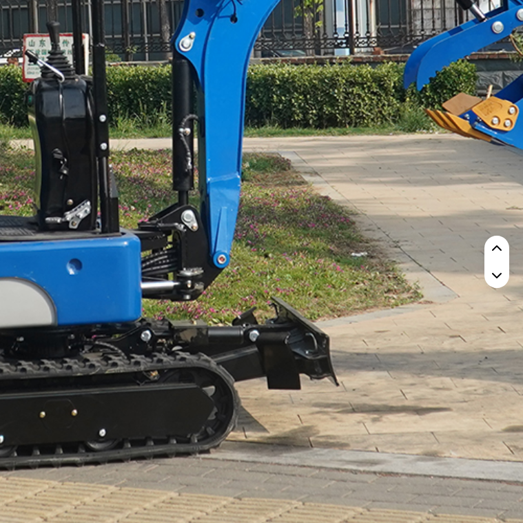 Blue Rippa R10-5 mini excavator with expanding rubber tracks and hydraulic thumb attachment on concrete path.