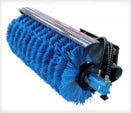 Blue brush roller with black base on a white background